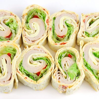tortilla deli wrap rolls with ham vegetable isolated on white ba
